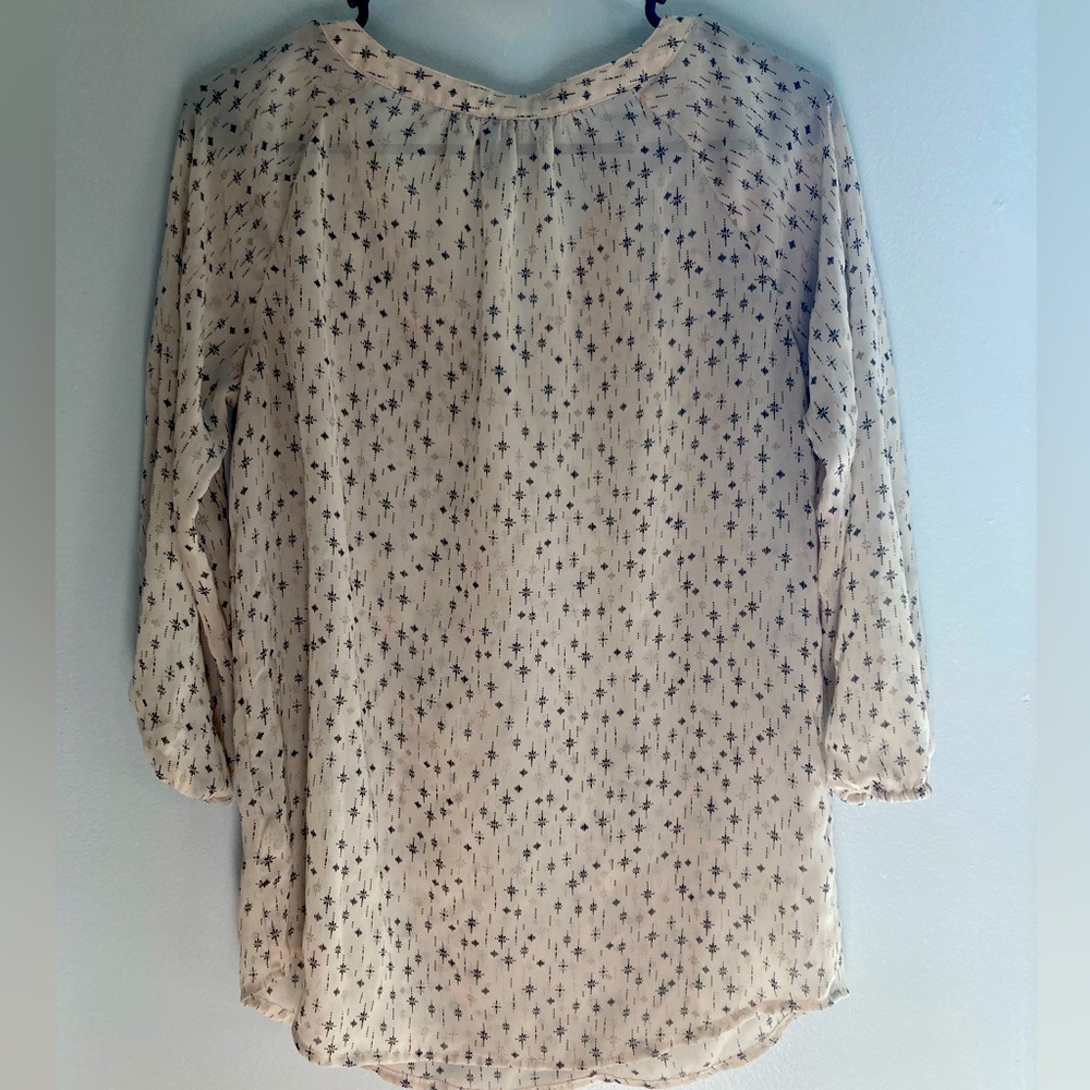 Super cute blouse!! See through lots of compliments!! Dress up or down!